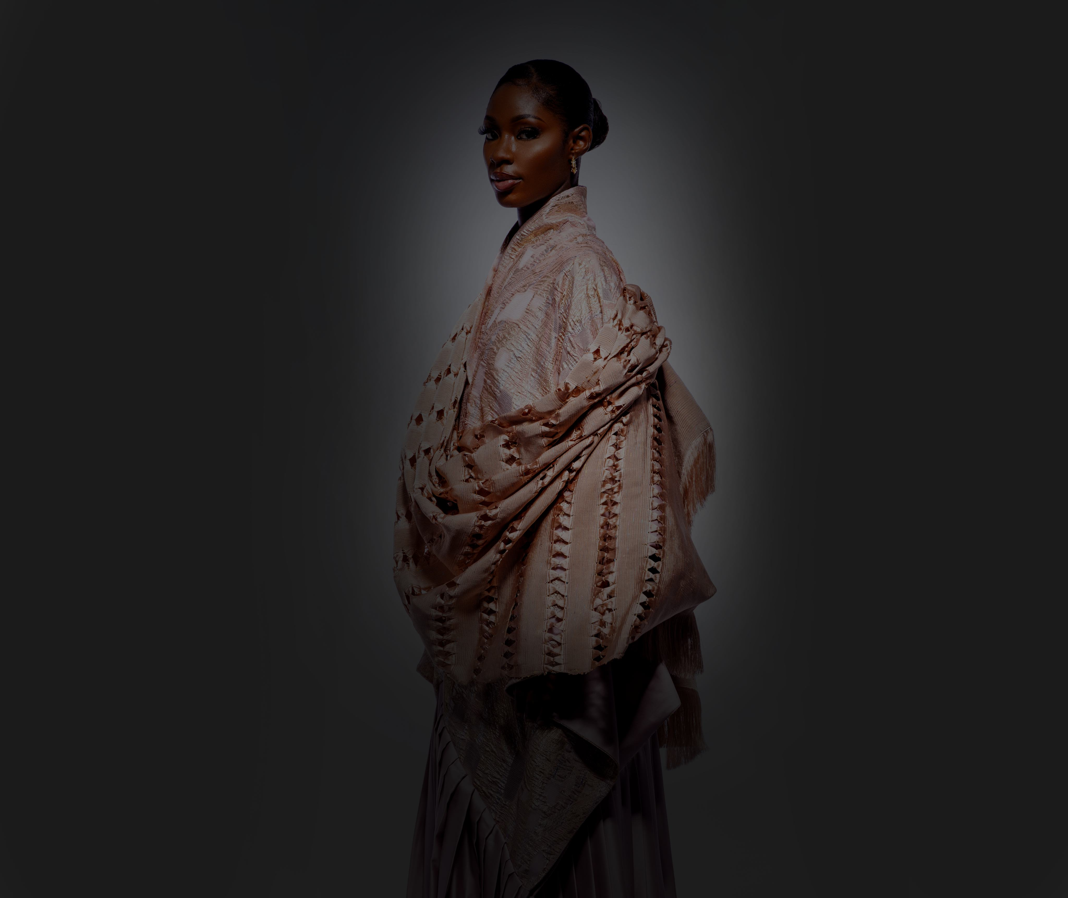 MAYYISAH model in an embroidered kimono on a dark editorial background